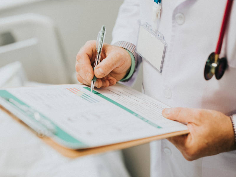 Person filling out pharmacy form in Edmonton AB